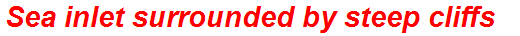 Sea inlet surrounded by steep cliffs